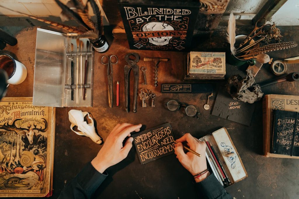 pexels photo 5095947 Artistic flat lay of a vintage workspace featuring rustic tools, stationery, and writing materials.